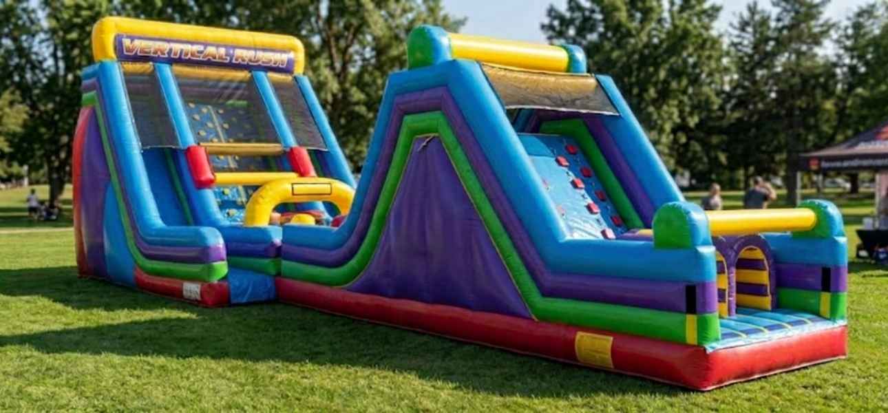 Kids racing the dual-lane 60ft Vertical Rush obstacle course rental in Chicago